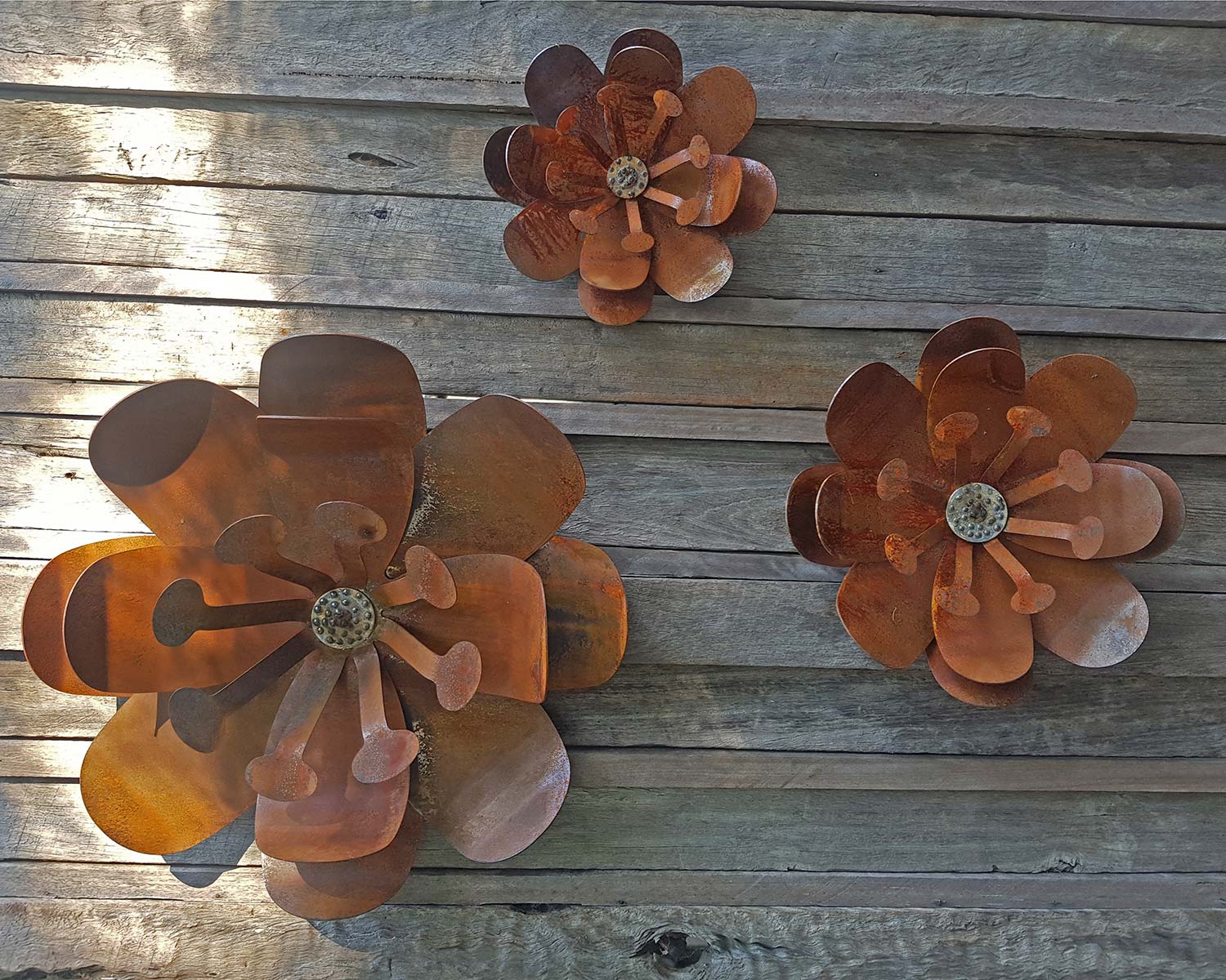 Corten steel flowers in three sizes - wall decorations