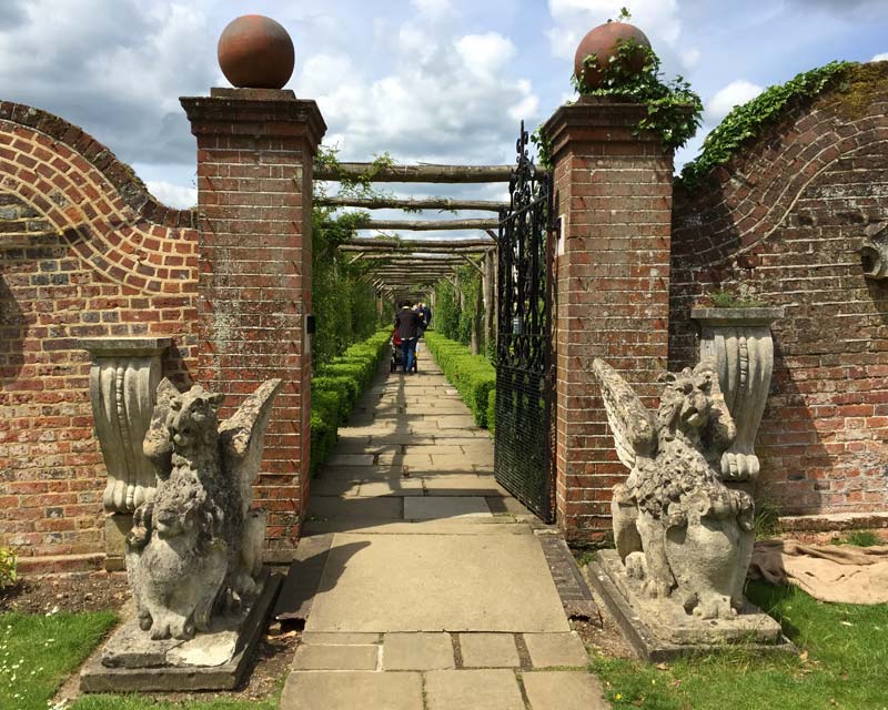 Stone griffins guard the entrance to the Rose Garden, Polesden Lacey