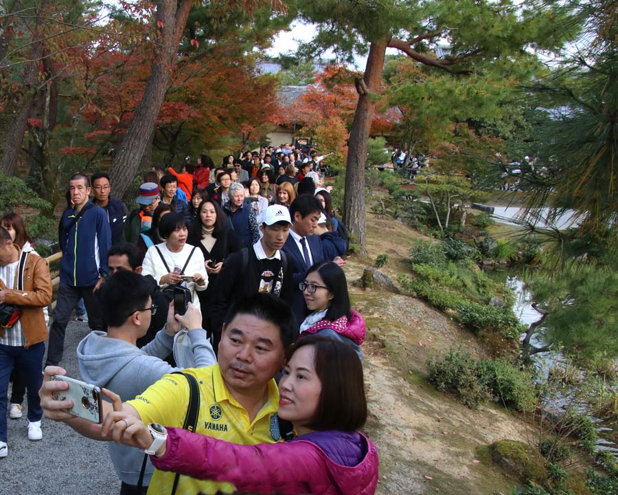 Kinkaku-ji, Golden Pavillion and Garden - tourists keen for selfies infront of Golden Pavillion