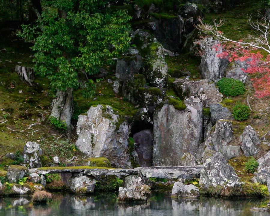 Carp rock half way up Dragon's Gate Waterfall, stone bridge thought to be oldest in Japan