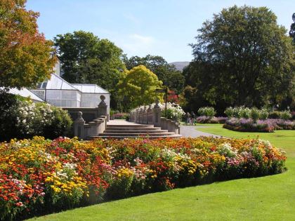 Glasshouse and beautiful borders in full bloom - photo supplied by Dunedin Botanic Garden