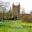 Spring view of Sissinghurst Tower from the orchard